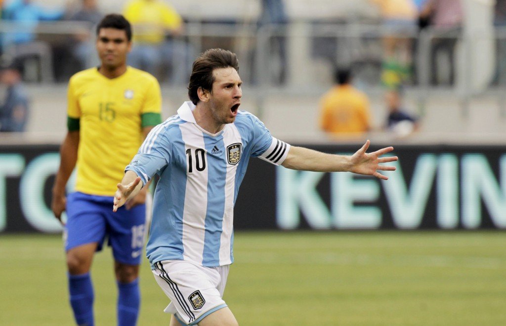 Argentina's Lionel Messi celebrates his game-winning goal - his third of the game - against Brazil during their international friendly soccer match in East Rutherford
